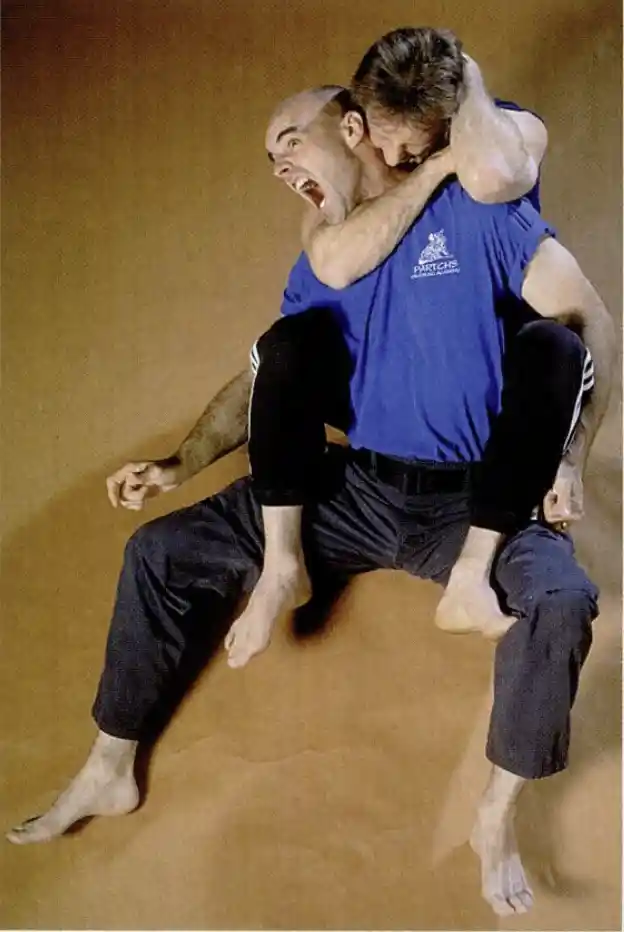 Small bites: With his hooks (feet) planted, Paul Vunak secures the head of opponent Jeff Clancy and nips his neck. Vunak says one of the essentials of kino mutai is to not bite off more than you can chew.